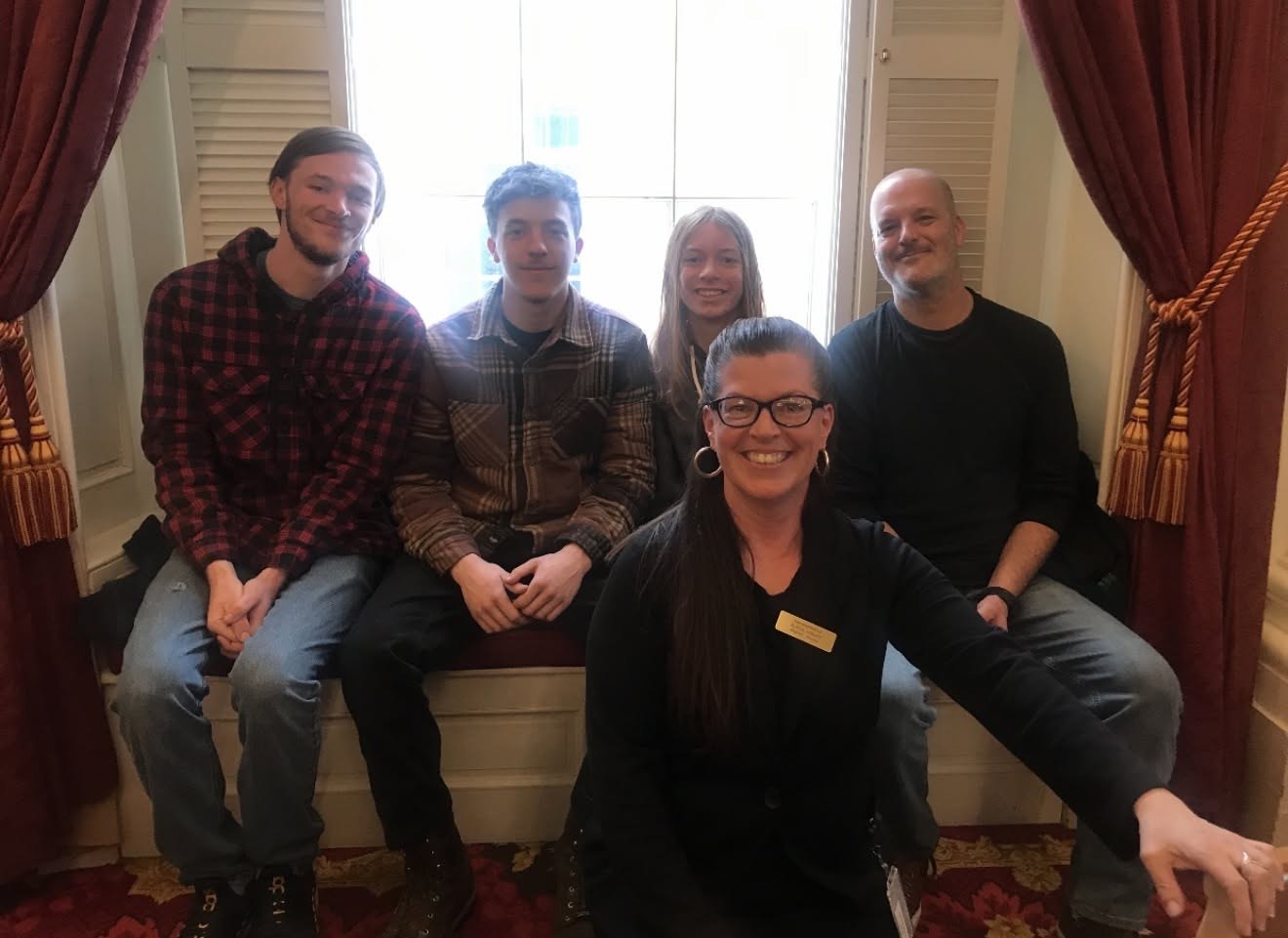 Alicia Malay with her family at the Vermont State House